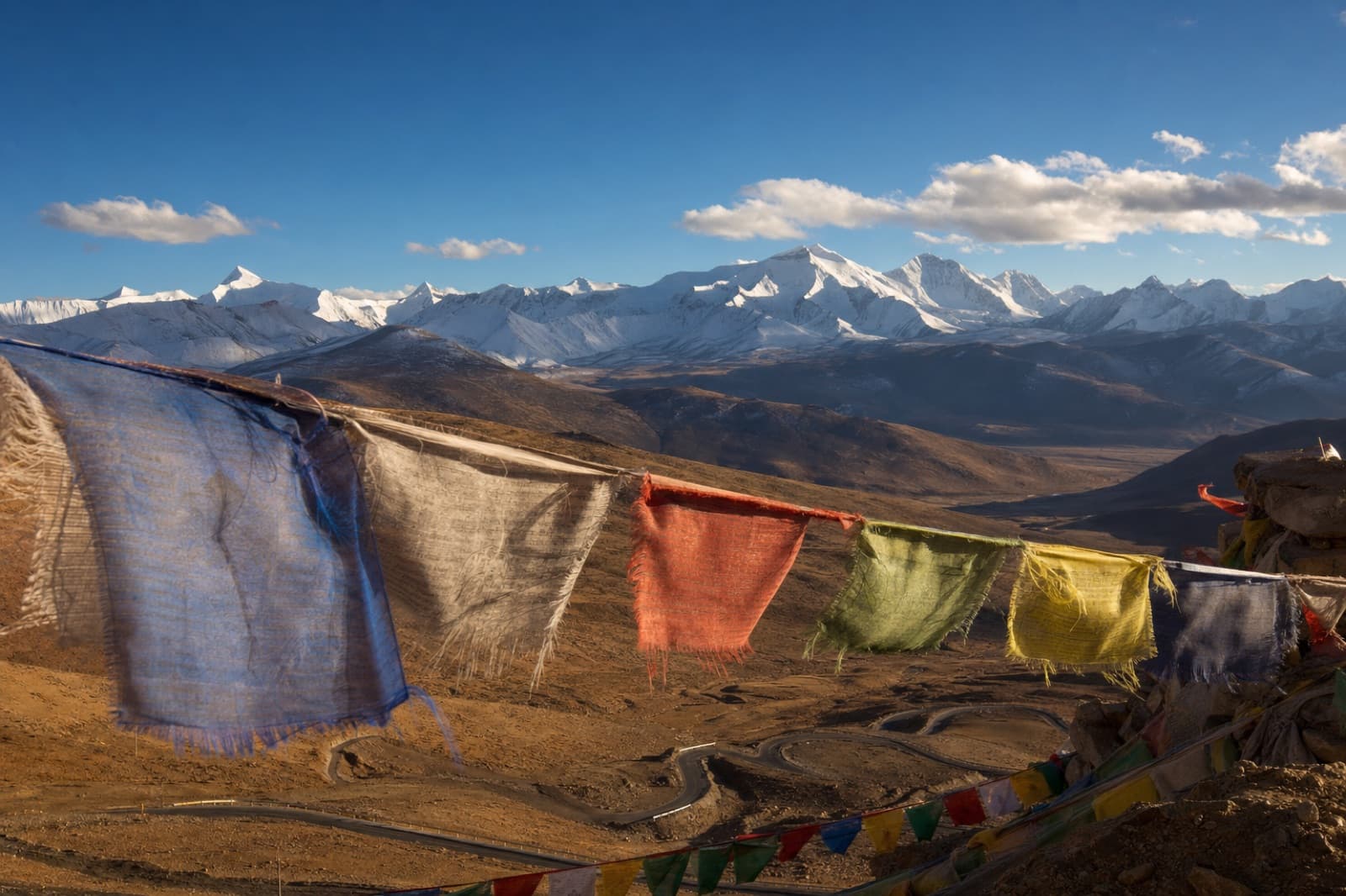 Prayer flags strung across a high mountain pass