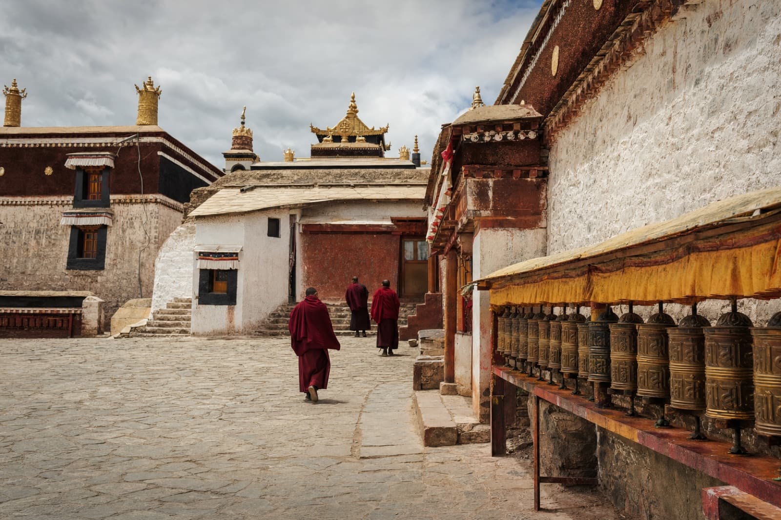 A Tibetan monastery courtyard with whitewashed walls